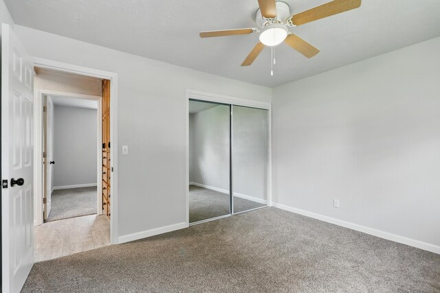 14289 Bethel Rd, Seneca, MO 64865 - unfurnished bedroom with carpet flooring, a closet, and ceiling fan