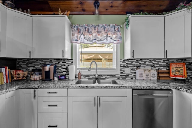 720 E Burford St, Marshfield, MO 65706 - kitchen featuring stainless steel dishwasher, white cabinets, and tasteful backsplash