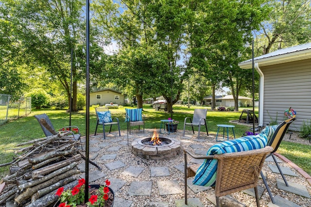 720 E Burford St, Marshfield, MO 65706 - view of patio featuring a fire pit