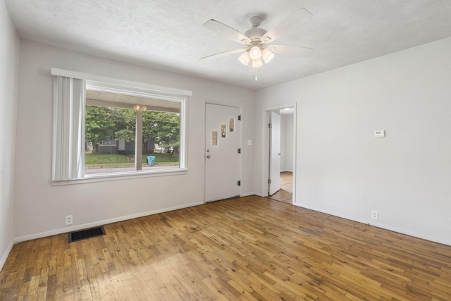 825 W Nichols St, Springfield, MO 65802 - unfurnished room with hardwood / wood-style flooring and a ceiling fan
