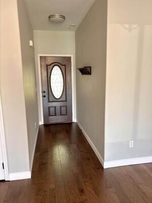 201 Sparrow Ln, Willard, MO 65781 - entryway with wood finished floors and baseboards