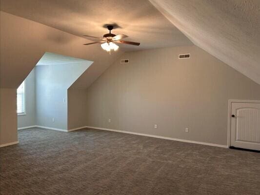 201 Sparrow Ln, Willard, MO 65781 - additional living space featuring lofted ceiling, ceiling fan, and dark carpet
