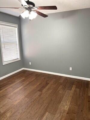 201 Sparrow Ln, Willard, MO 65781 - unfurnished room with dark wood-style flooring and a ceiling fan
