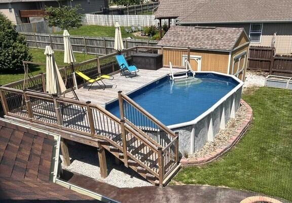201 Sparrow Ln, Willard, MO 65781 - view of pool with a wooden deck, a fenced backyard, and a shed