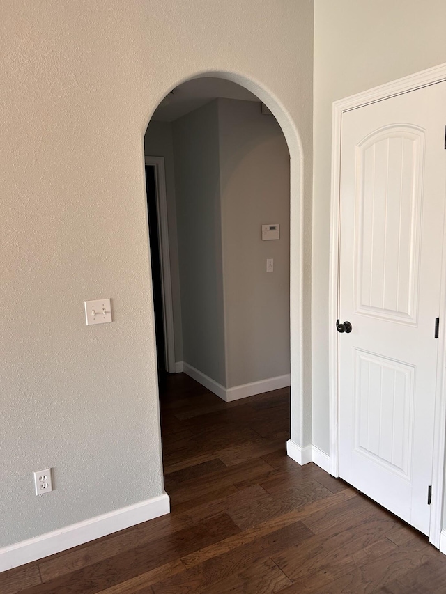 201 Sparrow Ln, Willard, MO 65781 - hallway with arched walkways and dark wood-style floors