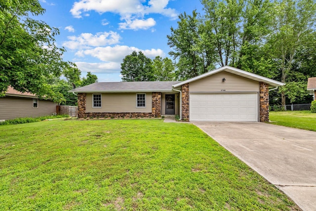 3748 S Hillcrest Ave, Springfield, MO 65807 - view of front facade with a garage, stone siding, and driveway
