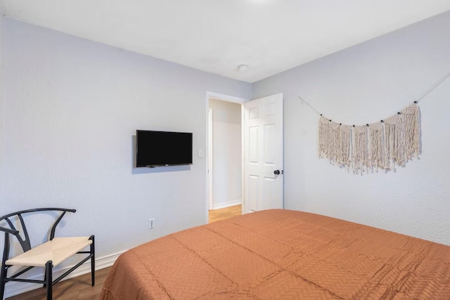 2436 S National Ave, Springfield, MO 65804 - unfurnished bedroom with wood finished floors and baseboards