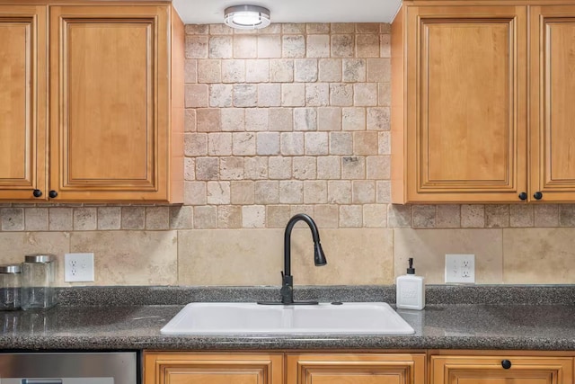 2436 S National Ave, Springfield, MO 65804 - kitchen featuring backsplash, stainless steel dishwasher, and brown cabinetry