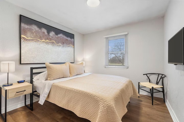 2436 S National Ave, Springfield, MO 65804 - bedroom with dark wood-style flooring and baseboards