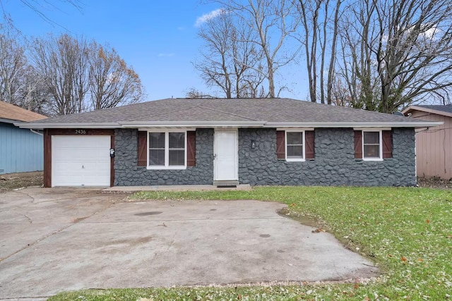 2436 S National Ave, Springfield, MO 65804 - ranch-style home with stone siding, an attached garage, a front yard, concrete driveway, and roof with shingles