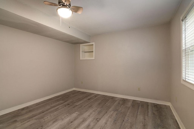 147 River Bluff Dr, Branson, MO 65616 - spare room featuring wood finished floors, healthy amount of natural light, and a ceiling fan