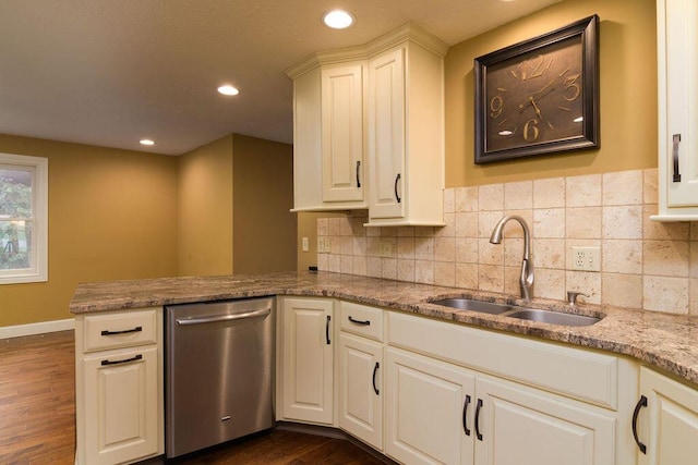 147 River Bluff Dr, Branson, MO 65616 - kitchen featuring dishwasher, a peninsula, dark wood-style flooring, recessed lighting, and light stone counters