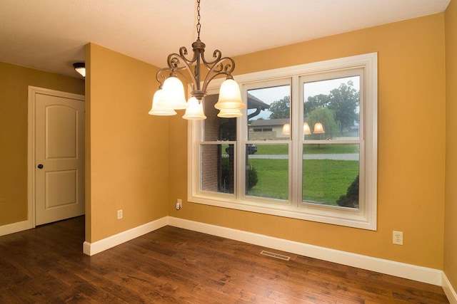 147 River Bluff Dr, Branson, MO 65616 - unfurnished dining area featuring a chandelier and dark wood-style flooring