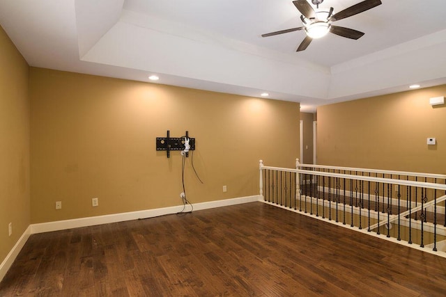 147 River Bluff Dr, Branson, MO 65616 - unfurnished room featuring a tray ceiling, wood finished floors, a ceiling fan, and recessed lighting