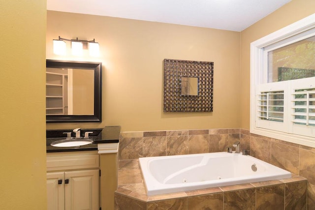 147 River Bluff Dr, Branson, MO 65616 - bathroom with vanity and a whirlpool tub