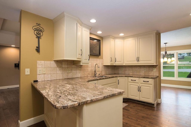 147 River Bluff Dr, Branson, MO 65616 - kitchen with white cabinets, dark wood-style floors, light stone countertops, and recessed lighting