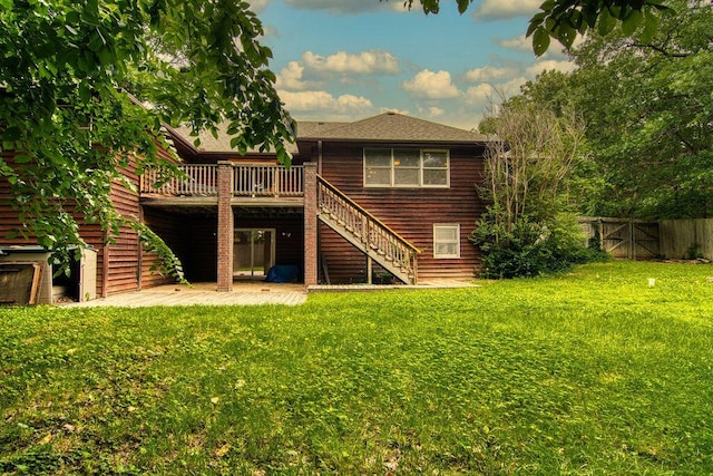 147 River Bluff Dr, Branson, MO 65616 - back of house featuring stairs, a wooden deck, a patio, and a shingled roof