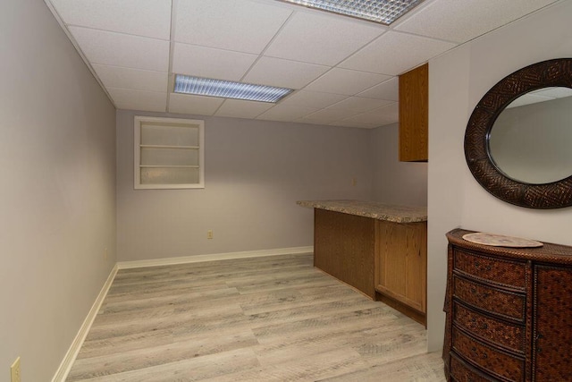 147 River Bluff Dr, Branson, MO 65616 - bar area with light wood finished floors, a drop ceiling, and built in features