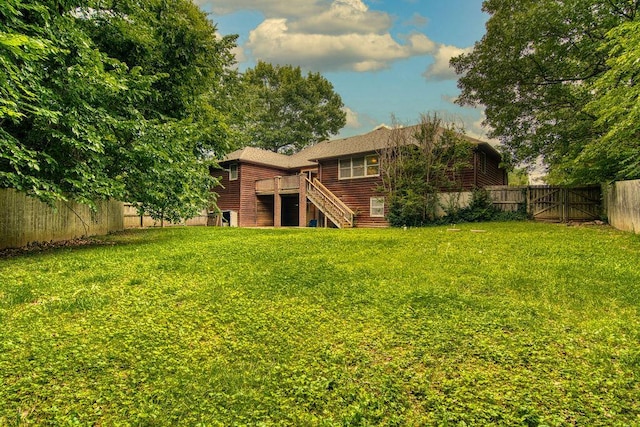 147 River Bluff Dr, Branson, MO 65616 - rear view of house featuring a fenced backyard, stairs, and a wooden deck