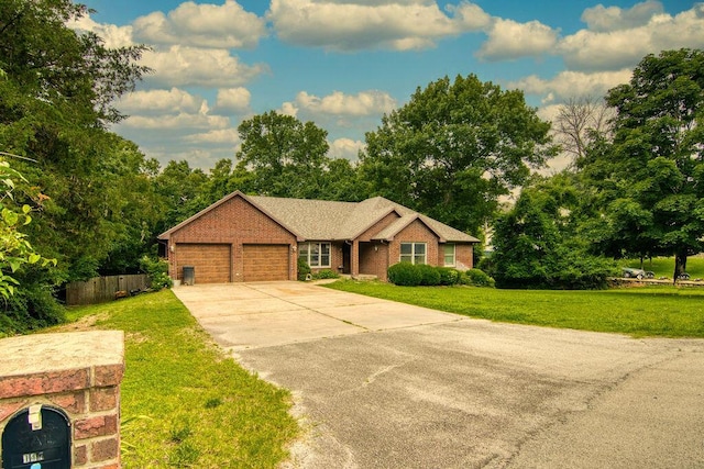 147 River Bluff Dr, Branson, MO 65616 - single story home with an attached garage, brick siding, concrete driveway, and view of scattered trees