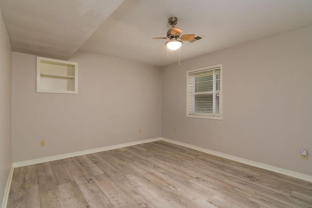 147 River Bluff Dr, Branson, MO 65616 - unfurnished room with wood finished floors and ceiling fan