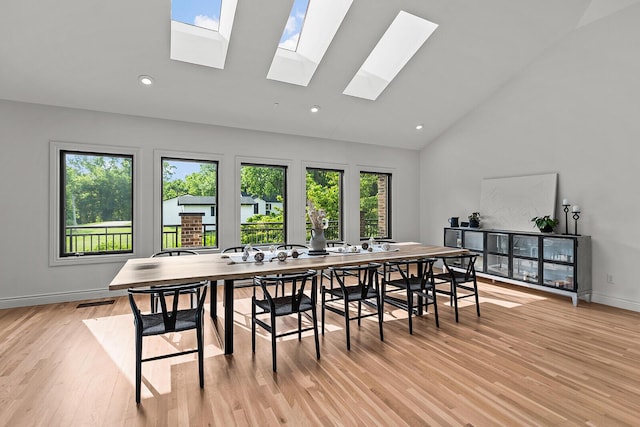 621 S Woodhaven Rd, Nixa, MO 65714 - dining room with high vaulted ceiling, healthy amount of natural light, a skylight, light wood-type flooring, and recessed lighting