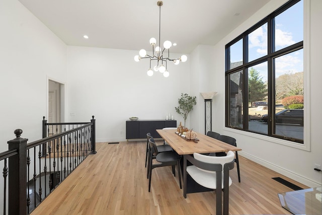 621 S Woodhaven Rd, Nixa, MO 65714 - dining room with light wood-style flooring, a chandelier, and recessed lighting
