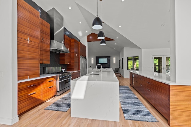 621 S Woodhaven Rd, Nixa, MO 65714 - kitchen featuring premium appliances, modern cabinets, wall chimney exhaust hood, recessed lighting, and high vaulted ceiling