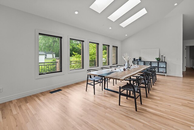 621 S Woodhaven Rd, Nixa, MO 65714 - dining area with a skylight, high vaulted ceiling, light wood-type flooring, and recessed lighting