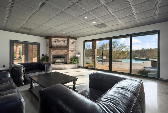 621 S Woodhaven Rd, Nixa, MO 65714 - living area featuring concrete flooring, recessed lighting, healthy amount of natural light, and a brick fireplace