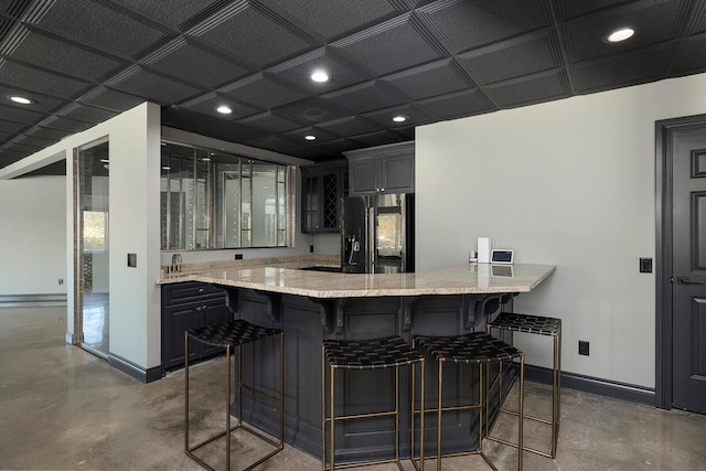 621 S Woodhaven Rd, Nixa, MO 65714 - bar with refrigerator with ice dispenser, concrete flooring, and recessed lighting