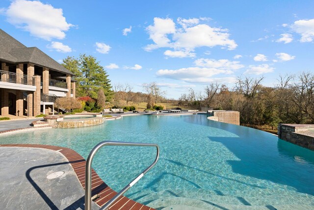 621 S Woodhaven Rd, Nixa, MO 65714 - view of pool with a pool with connected hot tub