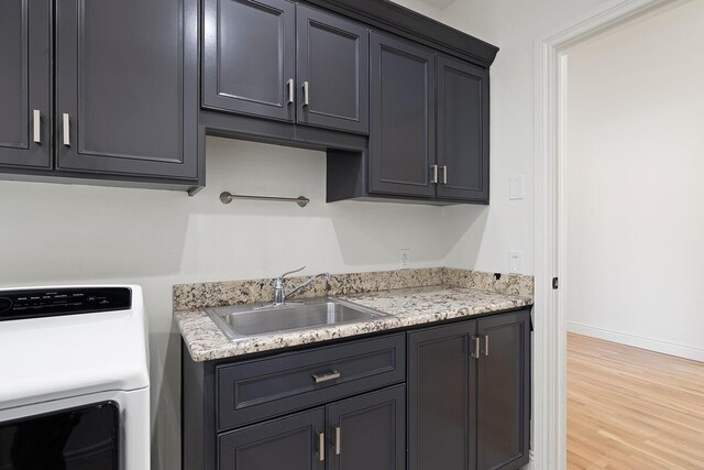 621 S Woodhaven Rd, Nixa, MO 65714 - kitchen featuring washer / dryer and light wood-style flooring