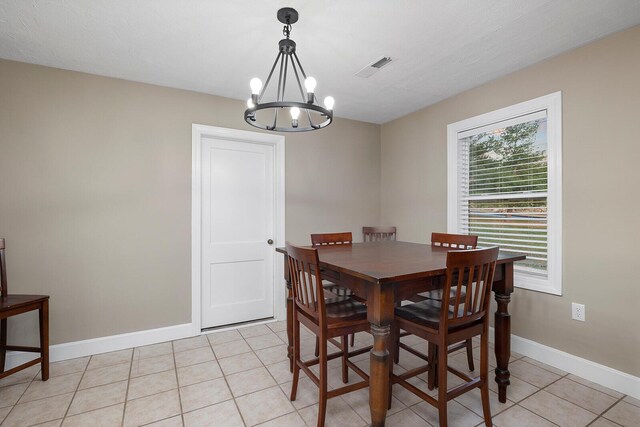 621 S Woodhaven Rd, Nixa, MO 65714 - dining area featuring a chandelier and light tile patterned flooring
