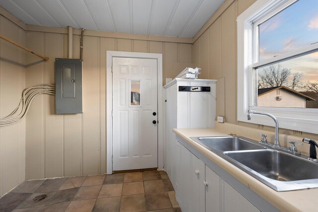 621 S Woodhaven Rd, Nixa, MO 65714 - kitchen featuring electric panel, a decorative wall, and light countertops
