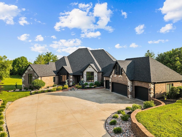 621 S Woodhaven Rd, Nixa, MO 65714 - french country inspired facade featuring brick siding, an attached garage, concrete driveway, a shingled roof, and a front yard