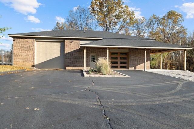 621 S Woodhaven Rd, Nixa, MO 65714 - view of parking with driveway and a garage