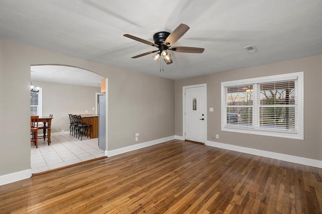 621 S Woodhaven Rd, Nixa, MO 65714 - entryway with arched walkways, wood-type flooring, ceiling fan, and a chandelier