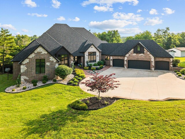 621 S Woodhaven Rd, Nixa, MO 65714 - french provincial home with a garage, concrete driveway, a front lawn, brick siding, and a shingled roof