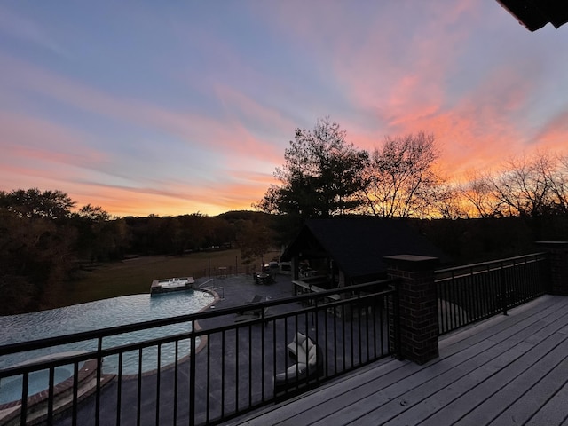 621 S Woodhaven Rd, Nixa, MO 65714 - deck at dusk featuring a patio area