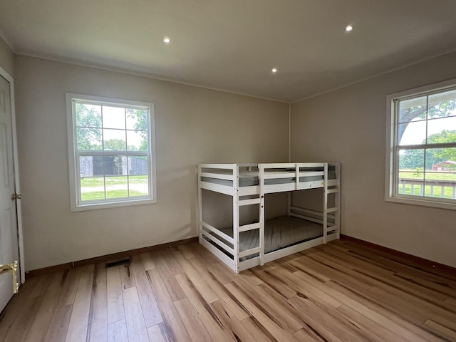 2191 County Road 2790, Mountain View, MO 65548 - unfurnished bedroom with wood finished floors, recessed lighting, and crown molding