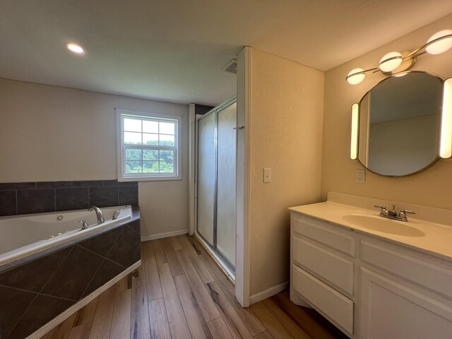2191 County Road 2790, Mountain View, MO 65548 - full bathroom with wood finished floors, vanity, a shower stall, and a bath