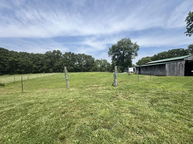 2191 County Road 2790, Mountain View, MO 65548 - view of green lawn with a pole building and an outbuilding