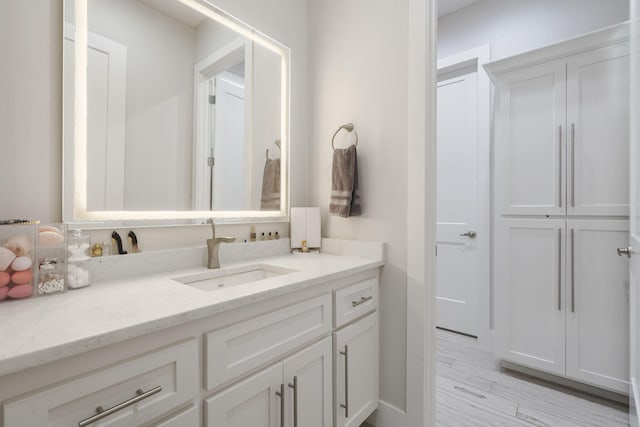 5817 E Summit View Dr, Springfield, MO 65809 - bathroom with vanity and wood finished floors