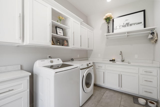5817 E Summit View Dr, Springfield, MO 65809 - laundry room featuring cabinet space, washing machine and dryer, and light tile patterned floors
