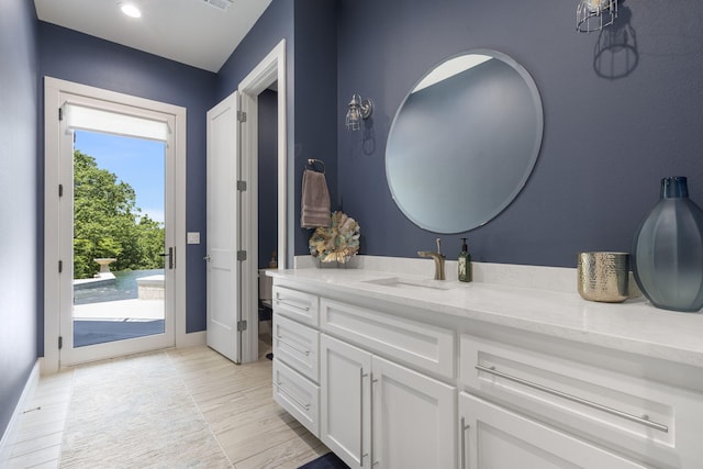5817 E Summit View Dr, Springfield, MO 65809 - bathroom with vanity and wood finished floors