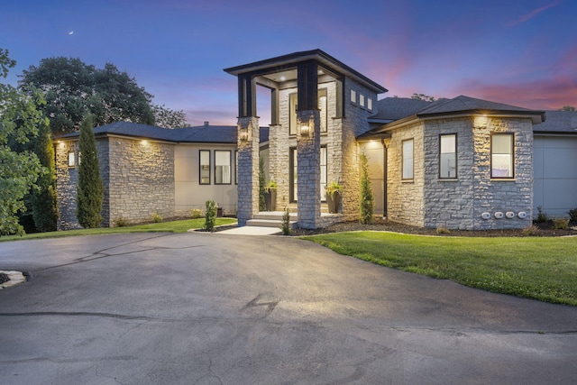 5817 E Summit View Dr, Springfield, MO 65809 - contemporary home featuring stone siding, a front lawn, and roof with shingles