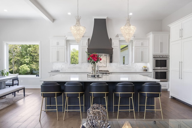 5817 E Summit View Dr, Springfield, MO 65809 - kitchen with custom range hood, a chandelier, double oven, decorative backsplash, and recessed lighting