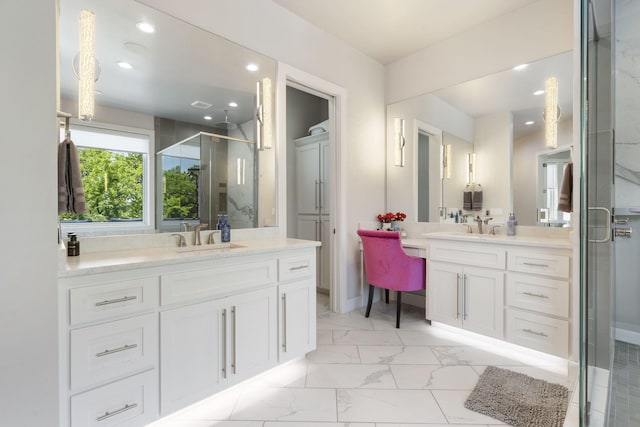 5817 E Summit View Dr, Springfield, MO 65809 - bathroom featuring two vanities, a shower stall, marble look tiles, and recessed lighting
