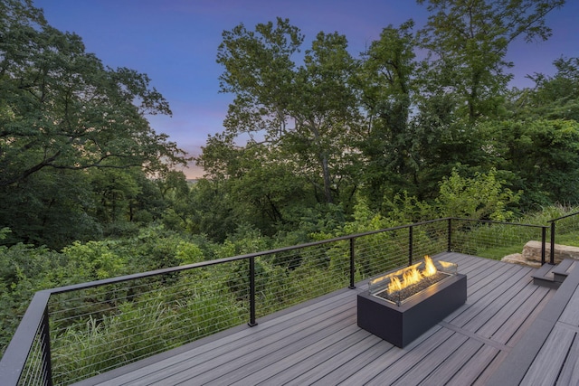 5817 E Summit View Dr, Springfield, MO 65809 - deck at dusk with an outdoor fire pit